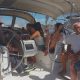 educatori e pazienti della Cooperativa Sociale Cento Fiori su una barca a vela nel porto di Rimini